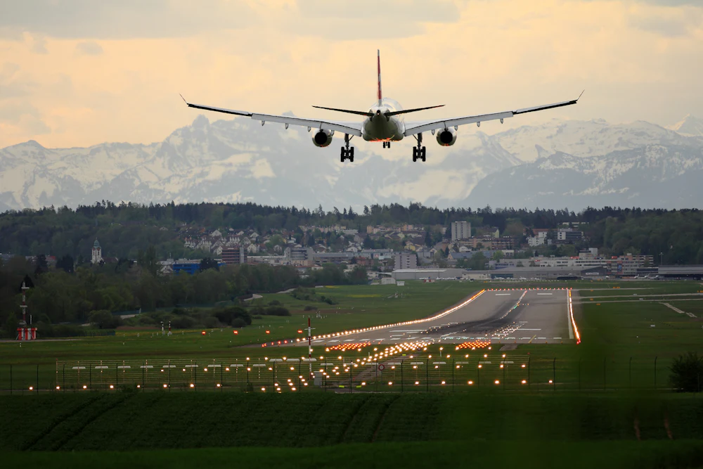 Aircraft landing near a New England town, arriving travelers who need a car rental delivered to Windham, NH
